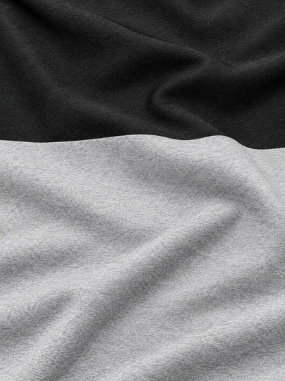 Schwarzer und grauer Golf-Pullover mit Colorblock-Design und kurzem Reißverschluss
