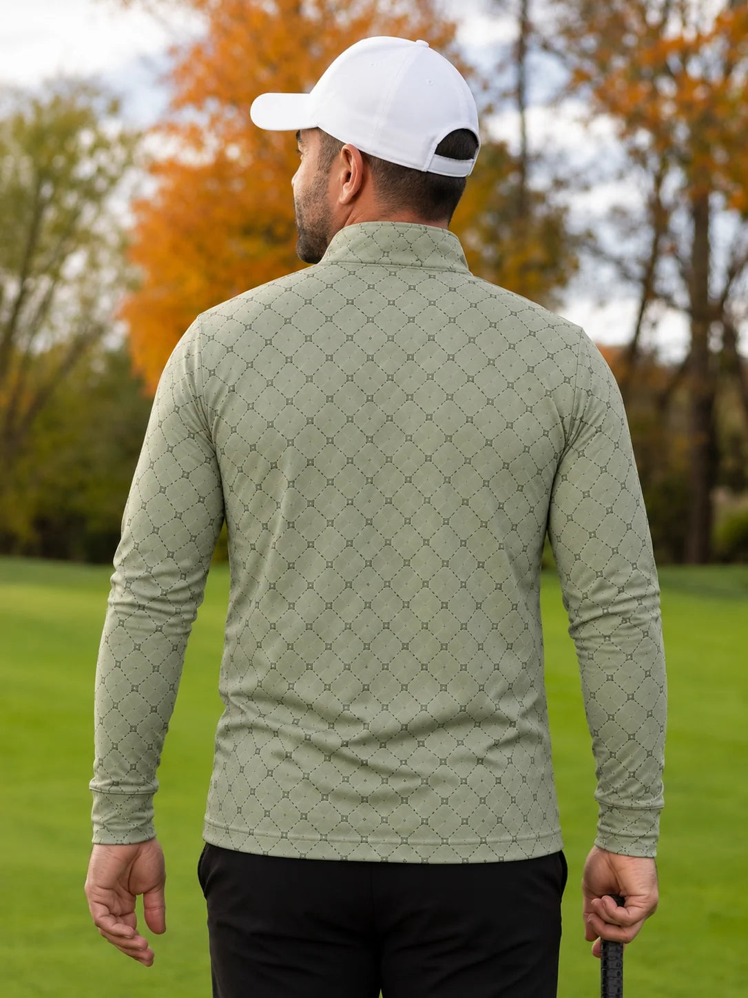 Salbeigrüner Golfpullover aus Funktionsmaterial mit geometrischem Muster und kurzem Reißverschluss