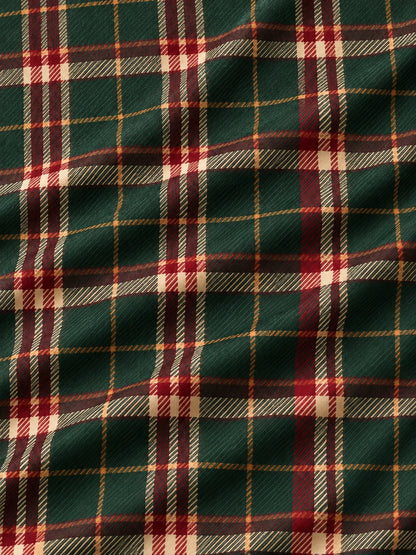 Golfpullover in Tannengrün mit weihnachtlichem Tartanmuster und Viertelreißverschluss