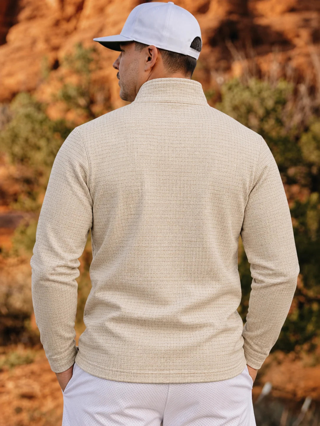 Golfpullover mit Korbgeflechtstruktur in Elfenbein, Funktionsmaterial und Viertelreißverschluss